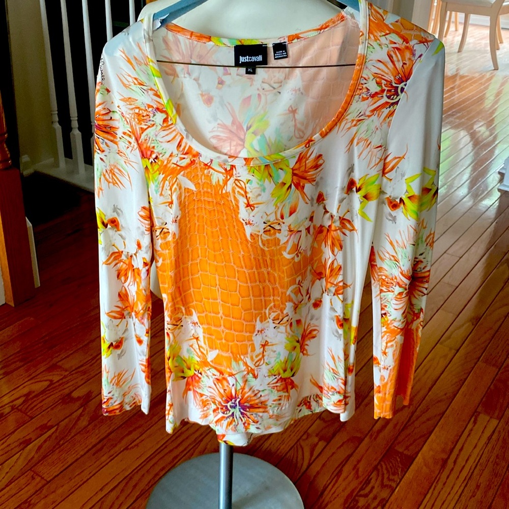 Long sleeved top with yoke neckline.